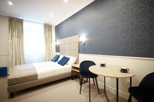 Ένα ή περισσότερα κρεβάτια σε δωμάτιο στο Apartamenty Klasztorna 25