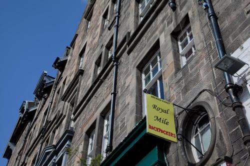 a building with a clock on the side of it at Royal Mile Backpackers in Edinburgh