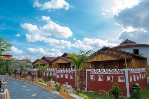 a row of houses with a fence in front at Sun Hotel and Resort, Mount Abu in Ābu Road