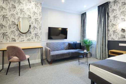 Μια τηλεόραση ή/και κέντρο ψυχαγωγίας στο Apartamenty Klasztorna 25