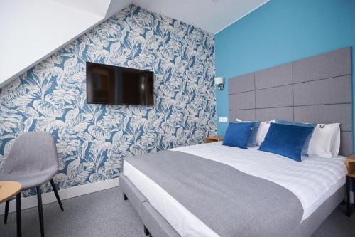 Ένα ή περισσότερα κρεβάτια σε δωμάτιο στο Apartamenty Klasztorna 25