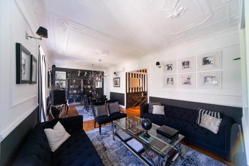 a living room with a couch and a table at Bliss Lisbon Apartments - Avenidas in Lisbon