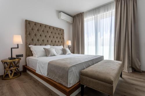 Кровать или кровати в номере Hotel & Resort ISOLA