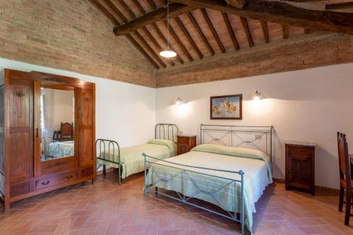 Ένα ή περισσότερα κρεβάτια σε δωμάτιο στο Agriturismo Vergelle