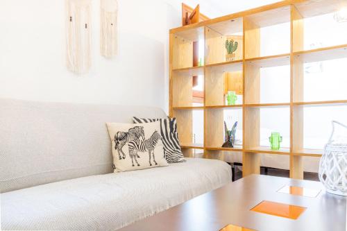 a living room with a couch and a table at Estudio en el Centro de Denia in Denia