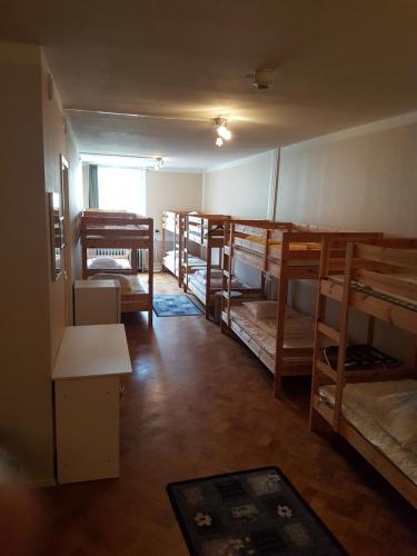 a room with a bunch of bunk beds at Hotell Kong Christian in Kristianstad