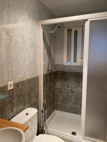 a bathroom with a shower and a toilet and a sink at Casa MARIA VILLARROYA in Villarroya