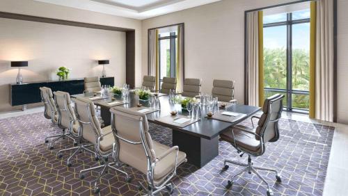 a conference room with a long table and chairs at Fairmont Riyadh in Riyadh