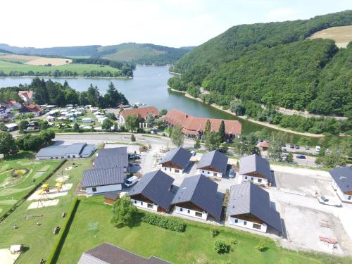 an aerial view of a village next to a river at Chaletpark Diemelsee in Heringhausen