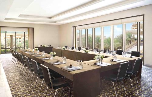 a large conference room with a long table and chairs at Fairmont Riyadh in Riyadh