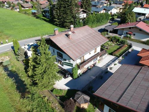 an overhead view of a house with a roof at Pension Alpentraum in Zell am See
