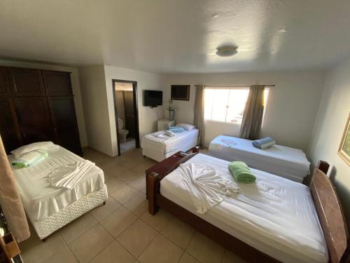 Uma cama ou camas num quarto em Hotel Rota Do Mar Inn Itajaí Navegantes