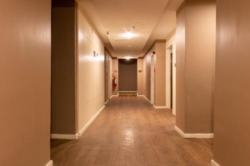 an empty hallway with a long corridor at Arosa Rio Hotel in Rio de Janeiro
