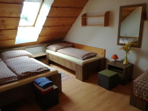 A bed or beds in a room at Apartmány Lenko - near thermal aquapark Tatralandia