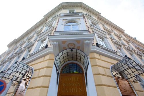 a building with a sign on the front of it at Hotel Kinsky Fountain in Prague