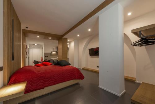 En eller flere senge i et værelse på Il Rubino Holiday House