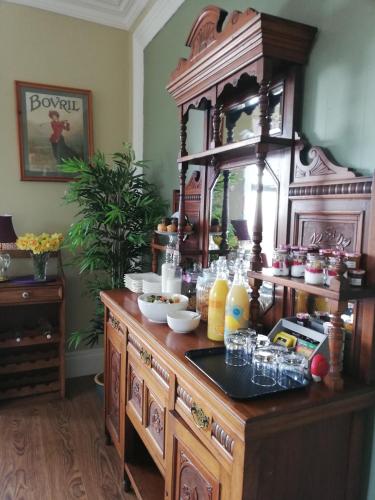 a large wooden buffet with food on it at Conlyn house in Newcastle
