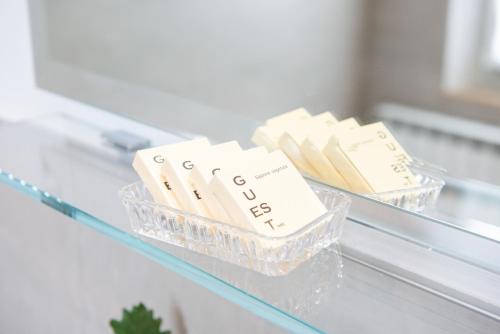 two plastic containers sitting on a glass shelf at Fonte Flavia in Urbania
