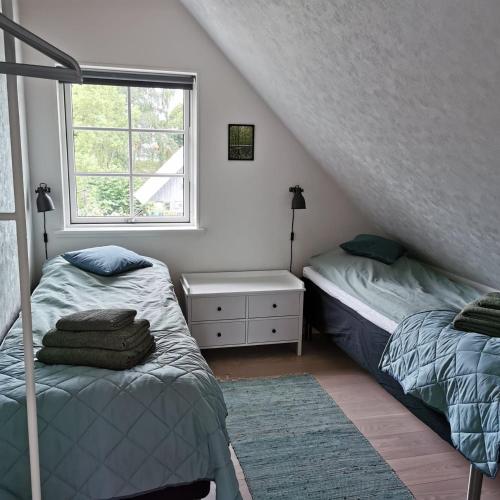 Tempat tidur dalam kamar di Samsø værelseudlejning