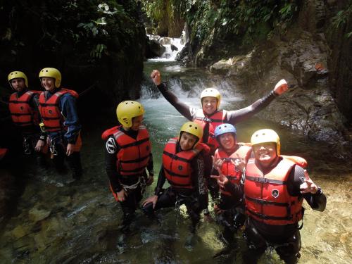 a group of people on a raft in a river at La Casa del Molino Blanco B&B in Baños