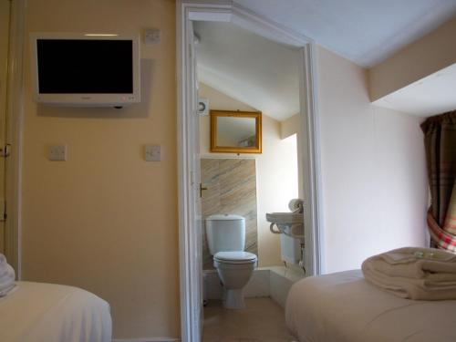 Cama ou camas em um quarto em Horseshoe Hotel