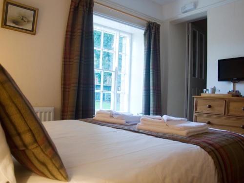 Cama ou camas em um quarto em Horseshoe Hotel