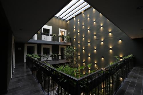 a building with a wall with lights on it at Hotel Isabel in Puebla