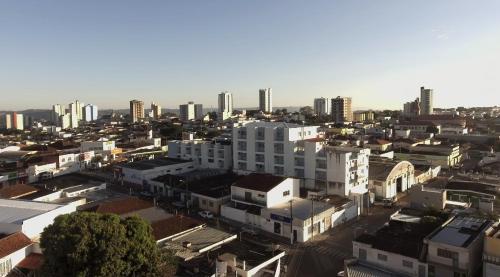 an aerial view of a city with tall buildings at BM Hotel in São Sebastião do Paraíso