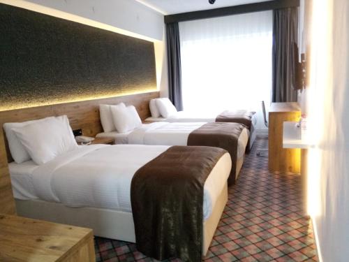 Postel nebo postele na pokoji v ubytování ESKOPPremium OTEL