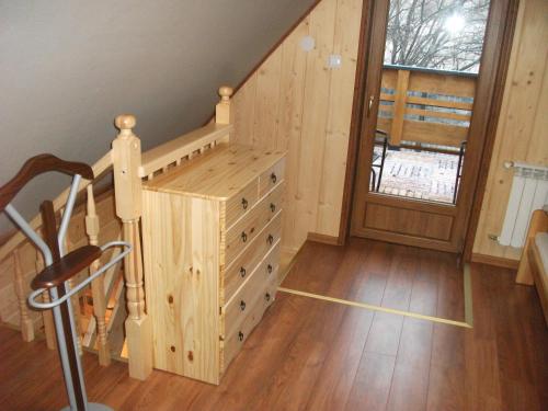 a wooden staircase in a house with a wooden floor at Pokoje ,,Goramiba''Jurgów in Jurgów