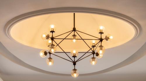 a chandelier hanging from a ceiling at Hotel Emperador centro Guadalajara y Remodelado in Guadalajara