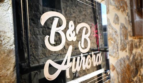 B&B AURORAに飾ってある許可証、賞状、看板またはその他の書類