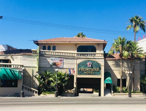 a building with a sign for a performance motel at Hotel Frontiere Tijuana in Tijuana