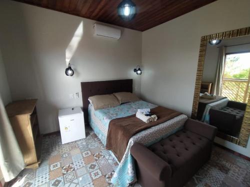 Cama o camas de una habitación en Hotel Praia Do Rosa