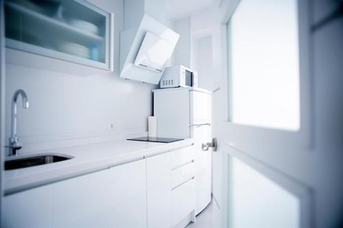 Kuchyň nebo kuchyňský kout v ubytování Apartamento Jardines de Cuenca
