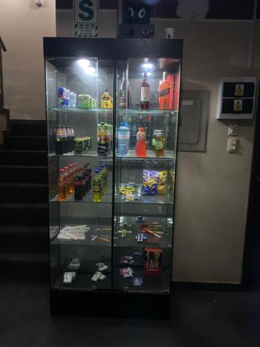 a refrigerator filled with lots of different types of drinks at Manantail Hotel No.003 in Puente Piedra