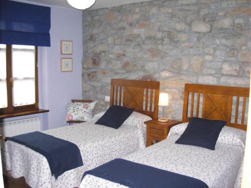 A bed or beds in a room at La Llosa Rodré