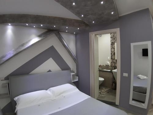 Кровать или кровати в номере Il Diamante