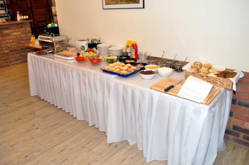 a table with a buffet of food on it at Vinařství Herůfek in Zaječí