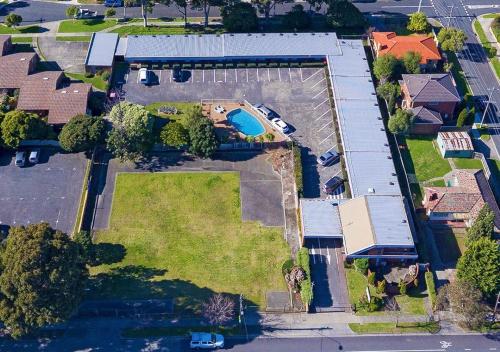 an overhead view of a house with a yard at Burwood East Motel in Burwood