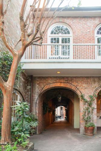 an entrance to a brick building with an archway at Place D'Armes Hotel in New Orleans
