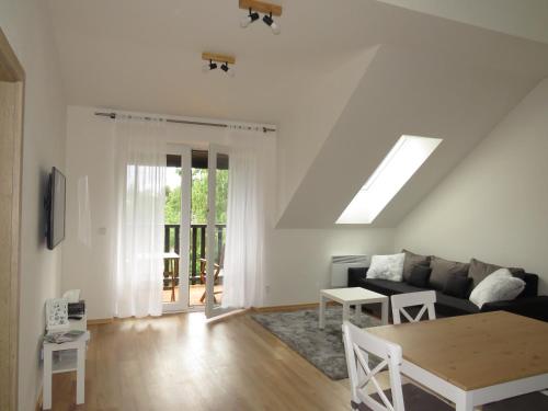 Телевизор и/или развлекательный центр в Apartman Honey