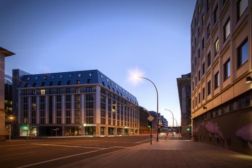 a city street with tall buildings and a street light at Holiday Inn Express - Berlin - Alexanderplatz by IHG in Berlin