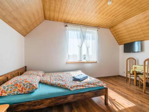 Un pat sau paturi într-o cameră la Kwatery prywatne Monika i Artur Lamczyk
