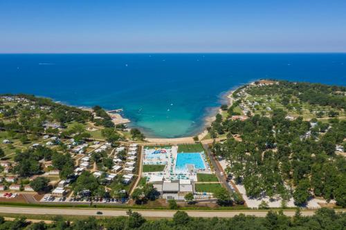 an aerial view of a resort next to the ocean at Camping Park Umag Mobile Homes in Umag