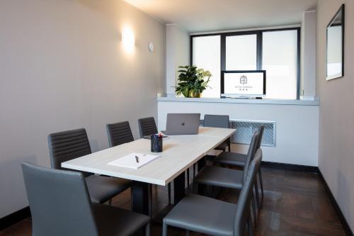 a conference room with a table and chairs at Hotel Esperia in Rho