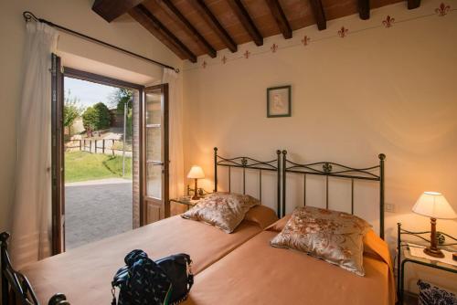 Ένα ή περισσότερα κρεβάτια σε δωμάτιο στο Agriturismo CaseGraziani