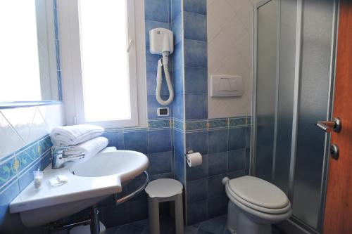 a bathroom with a sink and a toilet and a shower at Residence Panoramic in Maiori