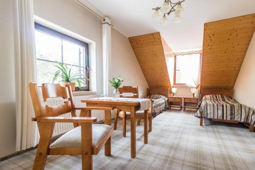 Posteľ alebo postele v izbe v ubytovaní Hotel Osada Karbówko Wellness & SPA