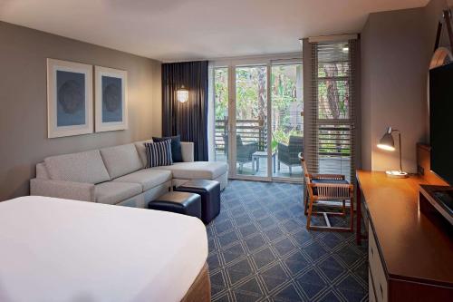 a hotel room with a couch and a living room at Hyatt Regency Mission Bay Spa and Marina in San Diego